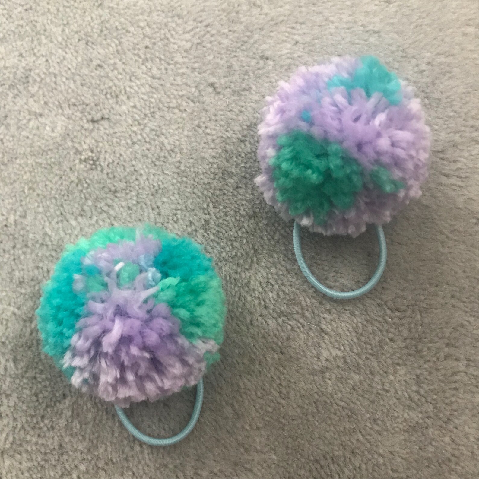 Set of green blue and purple yarn pom pom hair ties. Etsy