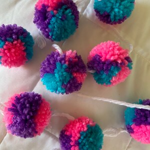 Pink, blue, and purple pom pom garland