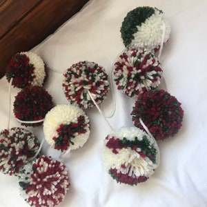 Evergreen, garnet red, and cream yarn pom pom garland