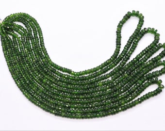 May include: Strands of faceted, deep green beads. The beads are strung together, creating multiple lines of the same gemstone. The beads are a rich, forest green color and appear to be small and uniform in size. The background is white.