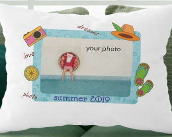 May include: A white rectangular throw pillow featuring a central photo frame graphic with the text your photo and summer 2019. The design includes illustrations of a pink camera, an orange hat, green flip-flops, a citrus slice, and the words love and dreams.