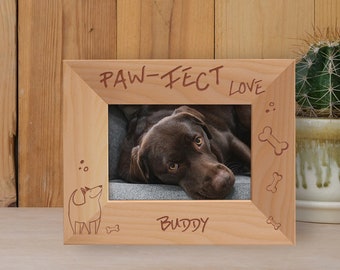 May include: A wooden photo frame with a dog picture inside. The frame is engraved with the text "Paw-fect Love" and "Buddy".