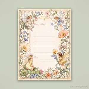 May include: A rectangular stationery sheet featuring a cream-colored center with horizontal lines for writing, bordered by illustrations of four winged fairies, various colorful flowers, and green foliage. The text reads Dear [Name] and Love.