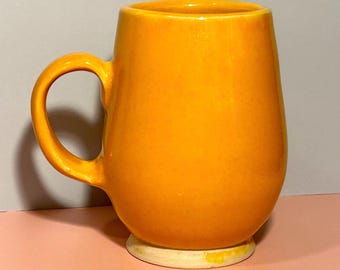 Handcrafted Yellow-Orange Ceramic Mug | Rounded Pottery Design