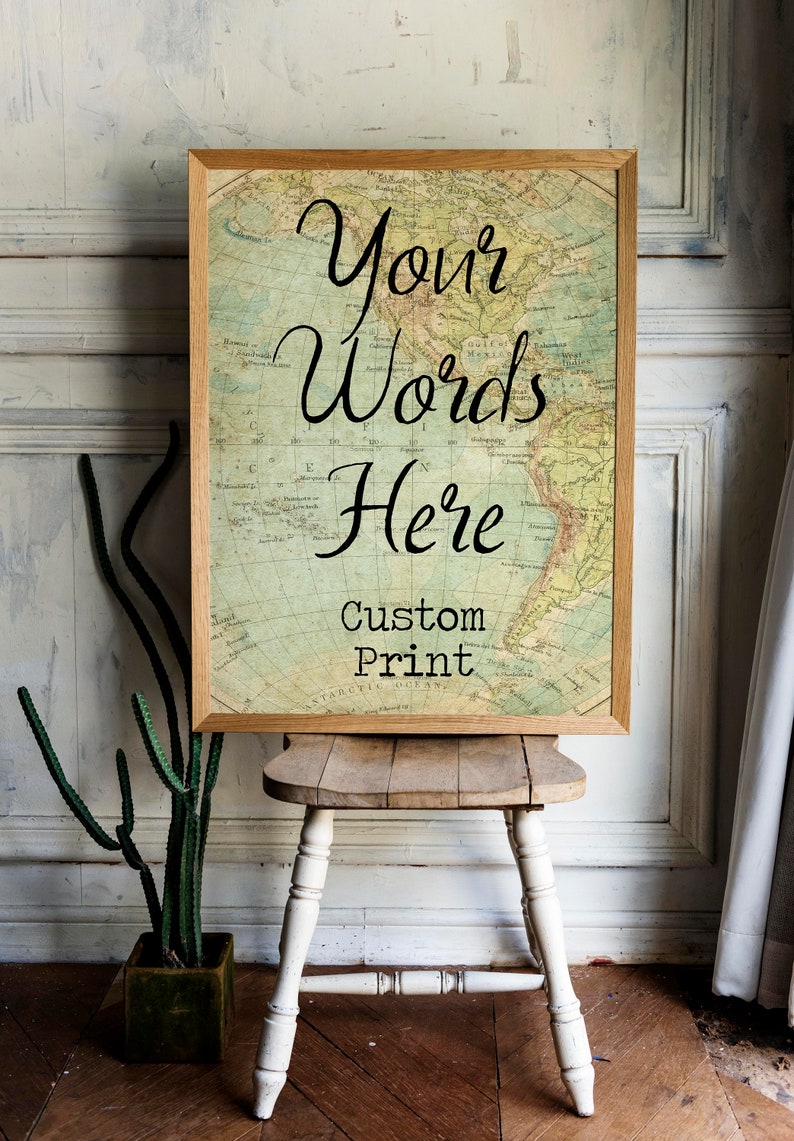 May include: A framed print with a vintage world map background. The text "Your Words Here" is written in cursive script. Below the text is the phrase "Custom Print".