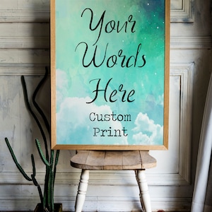 May include: A framed print with a watercolor background of blue and green clouds. The text "Your Words Here Custom Print" is printed on the image.