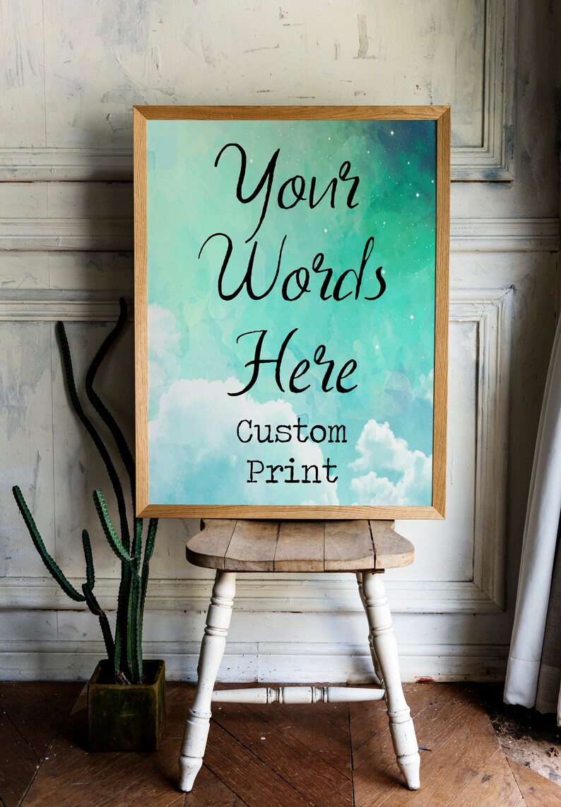May include: A framed print with a watercolor background of blue and green clouds. The text "Your Words Here Custom Print" is printed on the image.