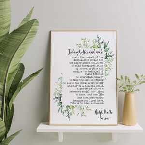 May include: A printable quote by Ralph Waldo Emerson, framed in a white frame with a green floral border. The quote reads: "To laugh often and much... This is to have succeeded."