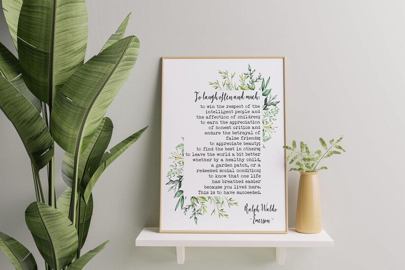 May include: A printable quote by Ralph Waldo Emerson, framed in a white frame with a green floral border. The quote reads: "To laugh often and much... This is to have succeeded."