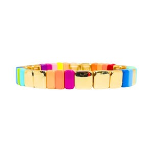 May include: A colourful rainbow bracelet with gold metal spacers. The bracelet is made of small square beads in shades of blue, green, yellow, orange, pink, and red.