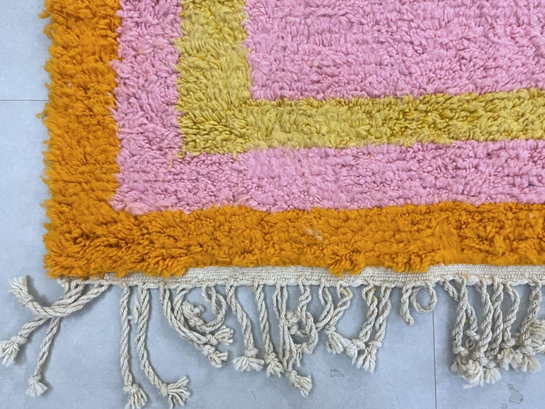 Unique handmade area rug, featuring warm and inviting tones.