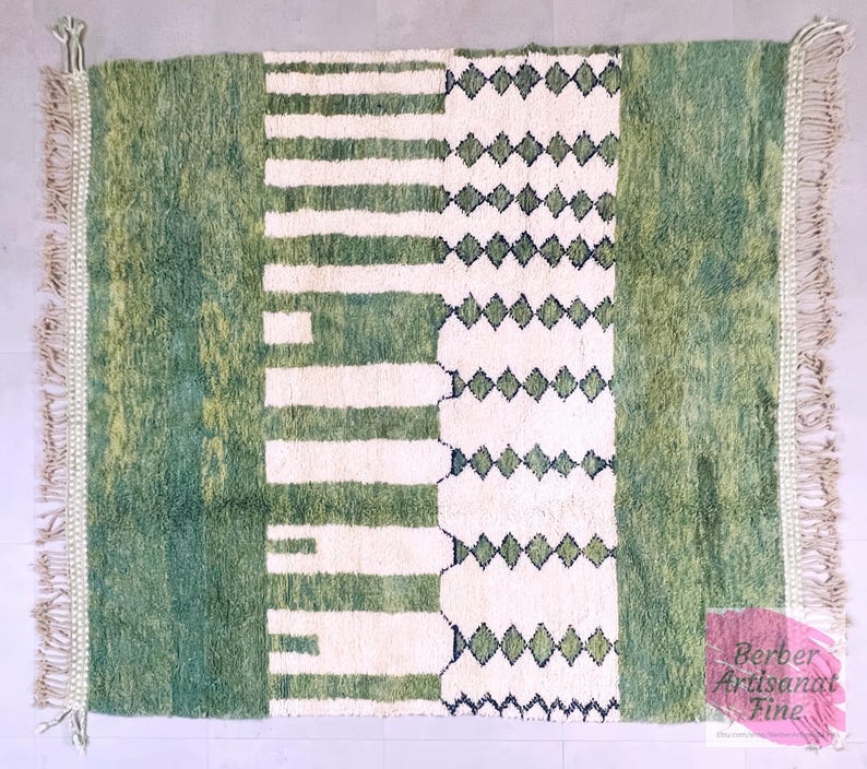 Top-down view of green Moroccan rug with abstract white lines and symmetrical design – wool area rug ideal for modern home decor
