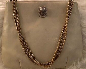 brown bolsa with gold chain