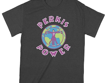May include: A dark heather grey t-shirt with a graphic of a person in a purple suit with the text "PERKIS POWER" in a circle around the graphic.
