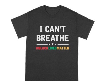 May include: A dark gray t-shirt with the text "I Can't Breathe" in white and the hashtag "#BlackLivesMatter" in red, green, yellow, and black.