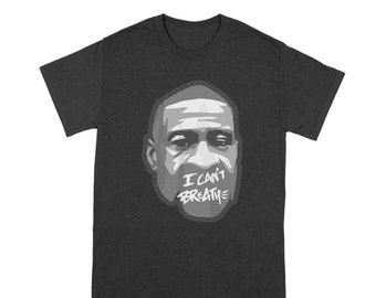 May include: A dark heather grey t-shirt with a black and white illustration of a man's face. The man's mouth is covered with tape that says "I can't breathe".