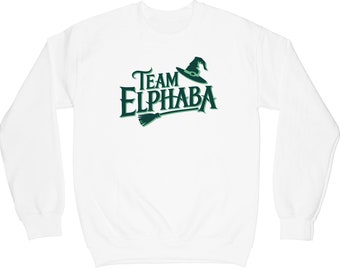 May include: White sweatshirt with a green graphic of a witch's hat and the text "Team Elphaba".