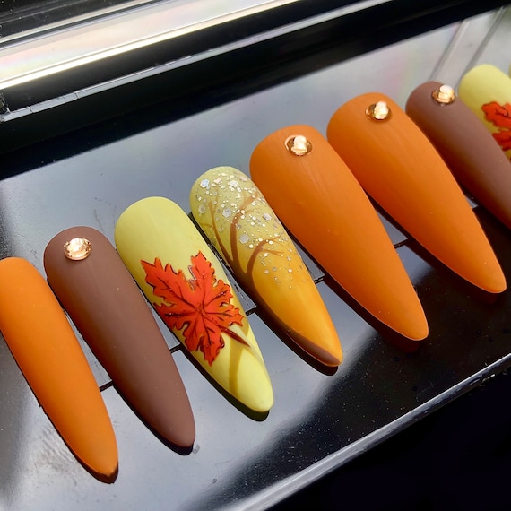 20 Fall Nail Ideas With Leaves, Plaid and Cozy Colors 6 Hand-Painted Maple Leaves
