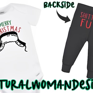 May include: White baby bodysuit with a black and white hat graphic and the words "MERRY CHRISTMAS" in green and red. The backside shows black baby pants with the words "SHITT ER'S FULL" in red.