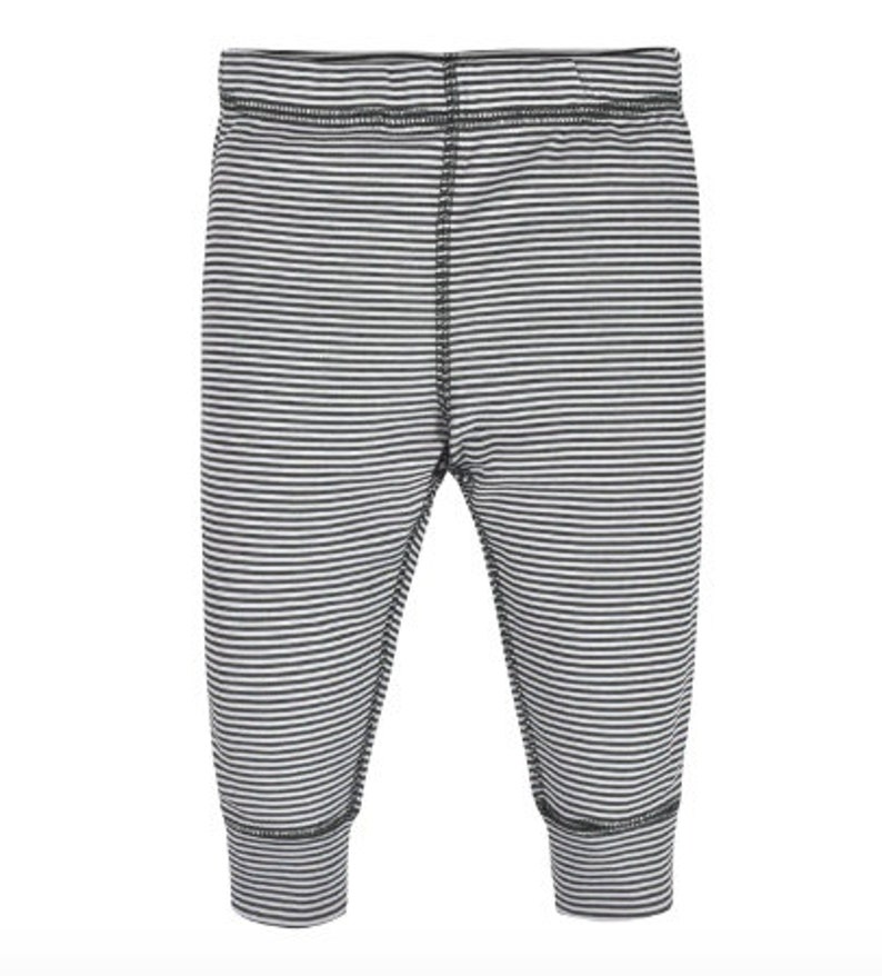 May include: Baby trousers in a grey and white striped pattern. The trousers feature a fitted ankle and an elasticated waistband. The horizontal stripes create a simple, classic design. Made from a soft, stretchy material, suitable for comfort.