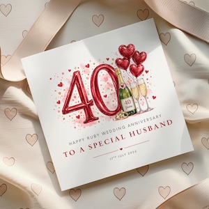 May include: A square greeting card featuring a large red number 40, red heart balloons, a champagne bottle, and two glasses. The text reads: Happy Ruby Wedding Anniversary To A Special Husband, 17th July 2026, and 40 Years on the bottle label.
