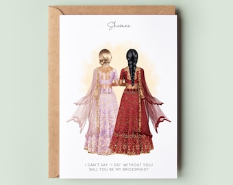 May include: A card with an illustration of two women in traditional Indian wedding attire. The text on the card reads "Shivani I CAN'T SAY 'I DO' WITHOUT YOU! WILL YOU BE MY BRIDESMAID?"