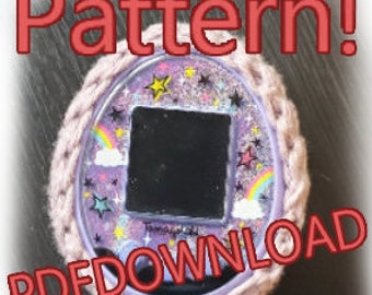 May include: A crochet pattern for a purple and pink Tamagotchi-style toy with a rainbow and stars design. The pattern is available for download as a PDF.