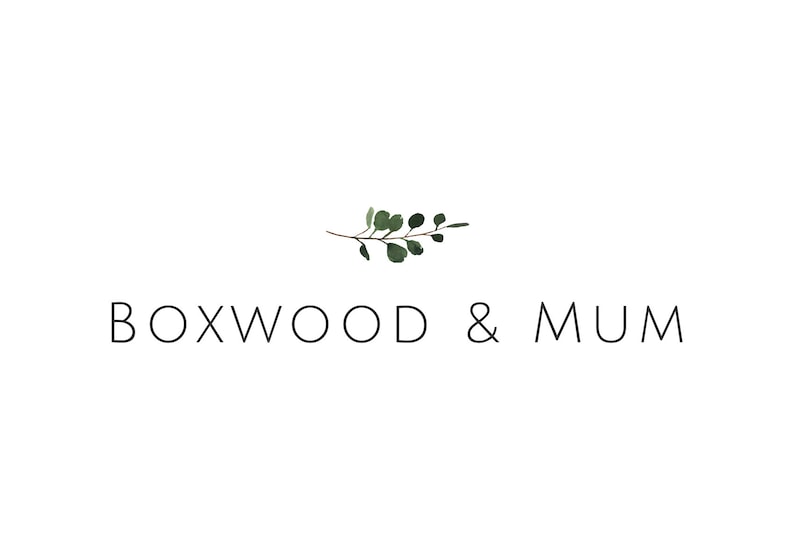 May include: A logo for a business called "Boxwood & Mum" with a simple illustration of a green branch with leaves.