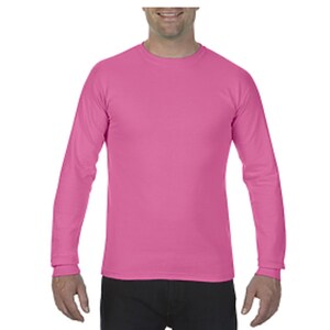 May include: A long-sleeved shirt in a bright pink color. The shirt has a crew neck and is made of a soft, comfortable fabric.