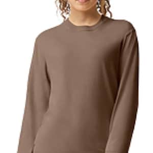 May include: A long-sleeved, brown, casual t-shirt with a crew neck.