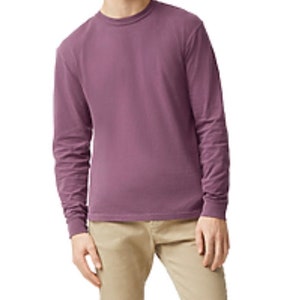 May include: A long-sleeved shirt in a mauve color. The shirt has a crew neck and is made of a soft, comfortable fabric.