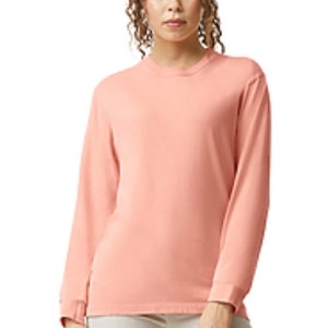 May include: A long-sleeved, light pink t-shirt with a crew neck.