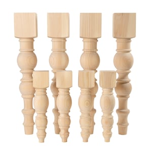 May include: Set of eight unfinished wooden table legs with a turned design. The legs are various sizes and are ready to be stained or painted.