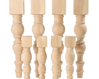 May include: Set of eight unfinished wooden table legs with a turned design. The legs are various sizes and are ready to be stained or painted.
