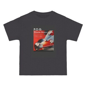 May include: A dark gray short-sleeve t-shirt featuring a rectangular graphic print. The design displays a red and white sports car with the text P.O.G. Porsche Owners Group Washington, DC printed in white above the vehicle illustration.