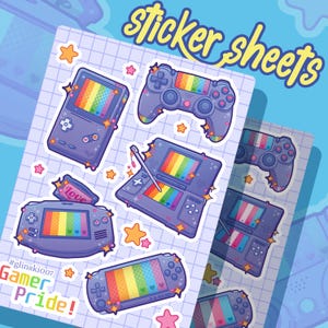 May include: Sticker sheets featuring various game consoles with rainbow-colored screens and accents. The text "sticker sheets" is in yellow script. The phrase "Gamer Pride!" is also visible.