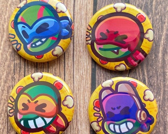 Pode incluir: Quatro botões redondos amarelos com um personagem de desenho animado em cada um. Os personagens usam máscaras e têm tons de pele diferentes. O fundo de cada botão é amarelo com um padrão de pipoca.