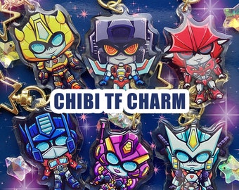 May include: A set of six colorful cartoon character charms featuring Transformers characters. The charms are made of clear acrylic and feature a variety of characters, including Optimus Prime, Bumblebee, Starscream, Megatron, and more. The charms are attached to gold keychains and are perfect for adding a touch of fun to your keys, bags, or backpacks.
