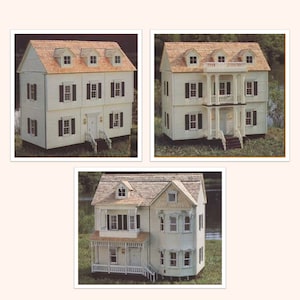 May include: Three white dollhouses with brown roofs and white trim. The dollhouses have multiple windows and doors. The dollhouses are on a green background.