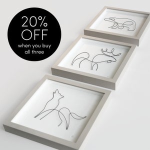 Könnte beinhalten: Drei gerahmte Kunstwerke mit minimalistischen Draht-Tierdesigns: ein Bär, ein Elch und ein heulender Wolf. Die Rahmen sind hellgrau und der Hintergrund ist weiß. Der Text "20% OFF when you buy all three" steht in einem schwarzen Kreis.