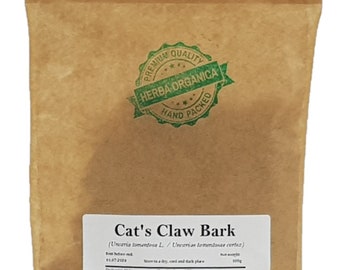 May include: A brown paper bag of Cat's Claw Bark, with a green and white "Herba Organica" seal. The bag has a white label with the product name and other details. The bag is filled with a herbal product.