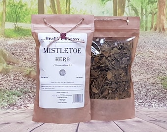 May include: A brown paper bag with a clear plastic window, containing dried mistletoe herb. The bag is labeled "Mistletoe Herb (Viscum album L.)" and has a website address printed on it.