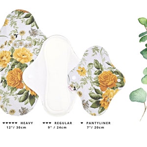 May include: Three reusable cloth menstrual pads in a floral print with yellow roses. The pads are labeled "Heavy" (12 inches / 30 cm), "Regular" (9 inches / 24 cm), and "Pantyliner" (7 inches / 20 cm).