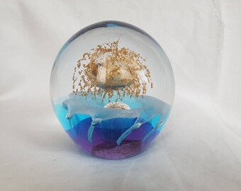 Large Mesmerizing Vintage Hand Blown Clear Glass Paperweight with a beautiful galaxy like scape throughout.