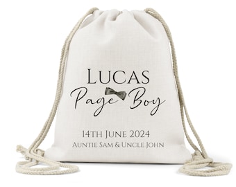 May include: White drawstring bag with the text "Lucas Page Boy" and a small bow tie graphic. The date "14th June 2024" and the names "Auntie Sam & Uncle John" are also printed on the bag.