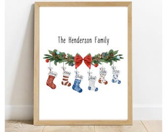 May include: A white printable art print with the text "The Henderson Family" above a watercolor illustration of a garland of green leaves with red berries and a red bow.  Six stockings hang from the garland, each with a different pattern and a name written on it: "Mommy", "Daddy", "Dolly", "Jack", "Little", and "Miss".