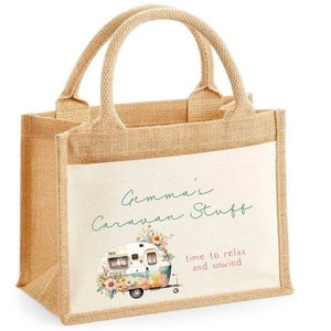 May include: A beige hessian tote bag with a white canvas insert. The canvas insert features a watercolour illustration of a vintage caravan with floral accents. The text "Gemma's Caravan Stuff" and "time to relax and unwind" is printed on the canvas insert.