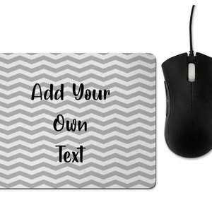 May include: A grey and white chevron patterned mouse mat with the text "Add Your Own Text".