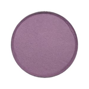 May include: A round, pressed eyeshadow pan in a muted purple color. The eyeshadow has a matte finish and is set in a silver metal compact. The product is isolated on a white background.