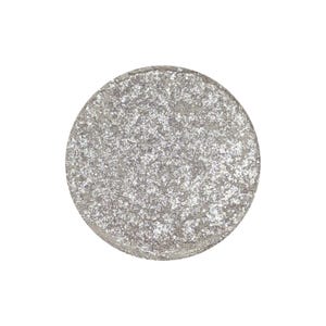May include: A round silver eyeshadow with a shimmery finish.